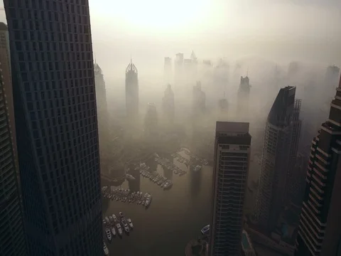 Aerial view of skyscrapers in Dubai Marina, at foggy sunrise. Stock Footage