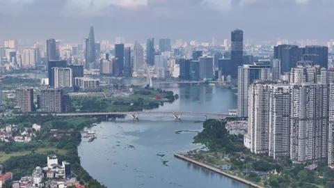 Aerial view of skyscrapers by saigon river in ho chi minh city vietnam Vídeo Stock 311871153
