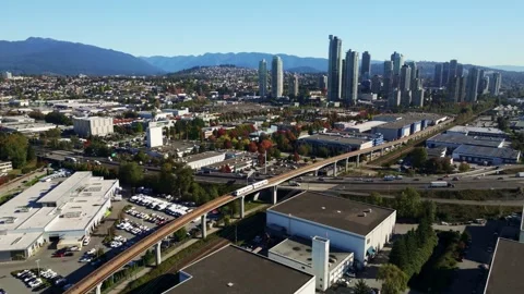 Aerial View Of SkyTrain Elevated Transit Line Near Boundary Rd In Vancouver Stock Footage 327619478