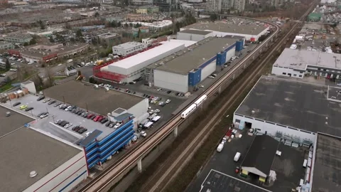Aerial View Of Skytrain Traveling On Elevated Tracks Near Brentwood Town Centre Stock-Footage 332678378