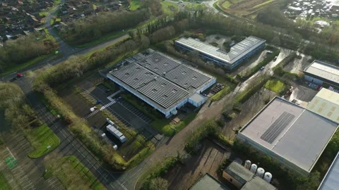 Aerial view of a sleek, modern data center in Milton Keynes providing Stock Footage 333023177