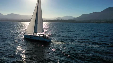 Aerial view of sloop sailing close to sunset. Stock Footage 136806154