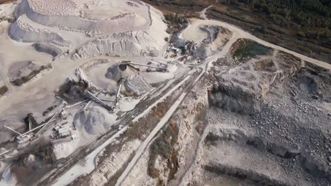 Aerial view of Slope operating granite quarry with mining equipment on ledges Stock Footage 167202734