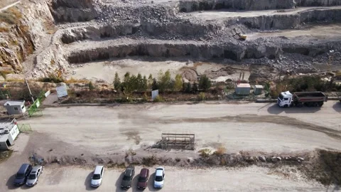 Aerial view of Slope operating granite quarry with mining equipment on ledges Stock Footage 167203853