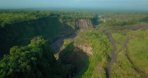 Aerial view of slope of volcano with Big valley with overgrown by trees on Vidéo 211991648