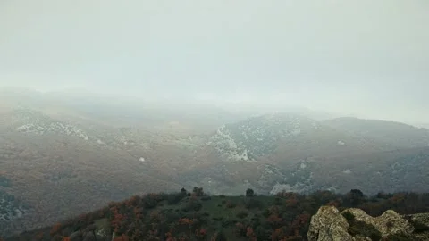 Aerial view of the slopes of a mountain range with rocks and sparse vegetation o Stock Footage 151150854