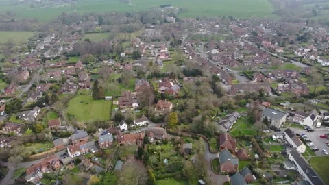 Aerial view, slow flight towards the village of Bratton in Wiltshire. Stock-Footage 172490691