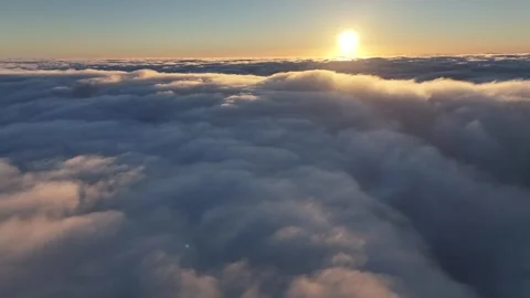 Aerial view of slow moving cloud blanket preparing to swallow up sunshine Stock Footage 337143985