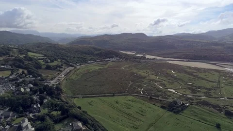 Aerial view, slow pan move. Drone panorama of sea bay during low tide by gree Stock Footage 94233095