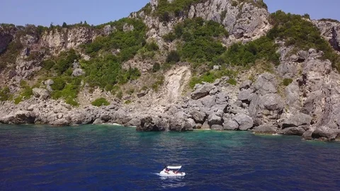 Aerial view slowly flying towards a cliff in Corfu Stock Footage 80314072