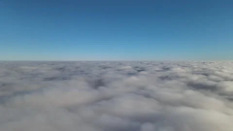 Aerial view of the slowly moving clouds from above, drone footage Stock Footage 254092512