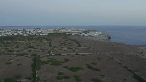 Aerial View Of Small Coast Town With Untouched Nature In The Foreground Stock Footage 136560140