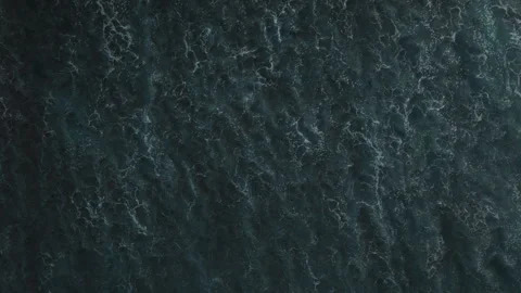 Aerial view of small coastal waves over black sand beach. Nusa Bali, Indonesia Stock Footage 316650201