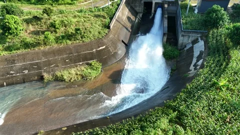 Aerial View of a Small Dam Floodgate Opens Stock Footage 309916825