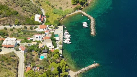 Aerial view of the small harbor and coastal village of Kalamakia on Alonnisos Stock Footage 346680520