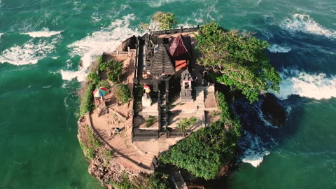 Aerial View of Small Hindu Temple with a bridge on Balekambang beach, Indonesia. Stock Footage 149256608