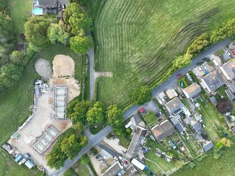 An aerial view of a small housing development on the e on the edge of some Stock Photos