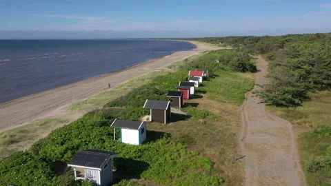 Aerial view of small huts on a beach in Bastad Stock Footage 156447438