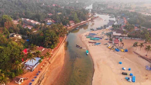 Aerial view of a small Indian river with wooden fishing boats on Baga Beach Stock Footage 126288282