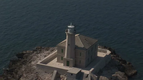 Aerial view of a small island with a lighthouse Stock Footage 36730947