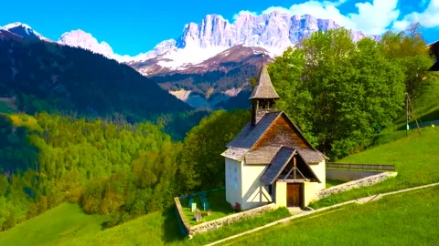 Aerial View of Small Mountain Chapel in Swiss Alps Stock Footage 346731705