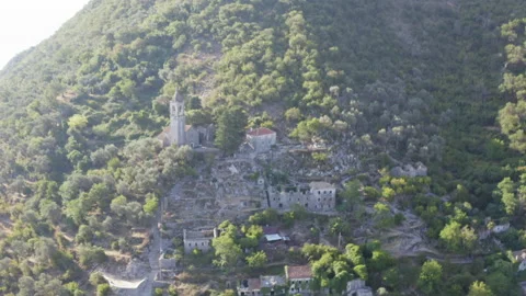 Aerial view of a  small old abandoned village in the mountain. 4K Stock Footage 204856881