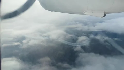 Aerial view from small propeller airplane flying through clouds in Fiji, South Stock Footage 339765454