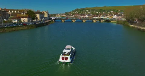 Aerial view of small river boat sails on the river Yonne in France passing a 動画素材 316820013