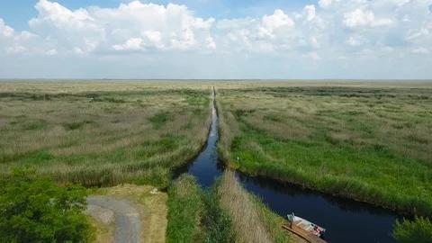 Aerial view of a small river at a marsh Stock Footage 115640979
