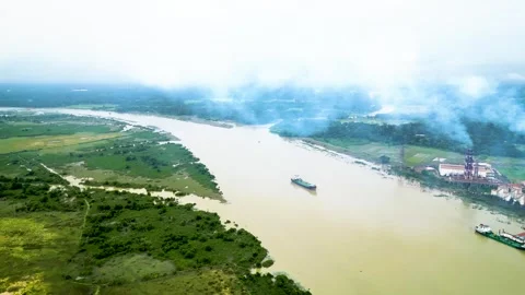 Aerial view of a small river with multiple branching waterways, framed by indust Stock Footage 287770570