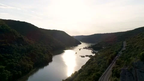 Aerial view of small river surrounded by forest Stock Footage 148998012