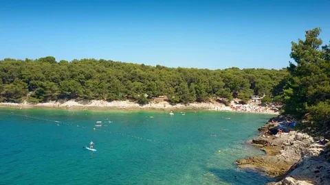 Aerial view of a small rocky beach resort. Summer vacation time Stock Footage