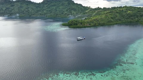 Aerial View of Small Ship and Shallow Reefs in Solomon Islands Stock Footage 231453731