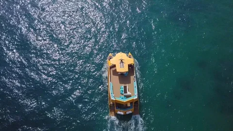 Aerial view: A small ship in the sea, a tourist ship sailing Stock Footage 100029853