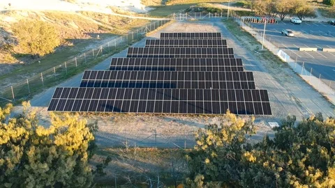 Aerial view of a small solar panel farm built close to a remote coastal Video stock 114356590