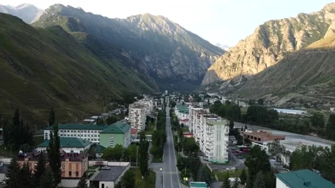 Aerial view of the small town between mountains Stock Footage 160617684