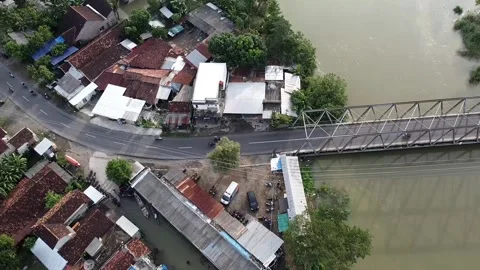 Aerial view of small town with bridge over river at Pati, Indonesia Stock-Footage 279309558
