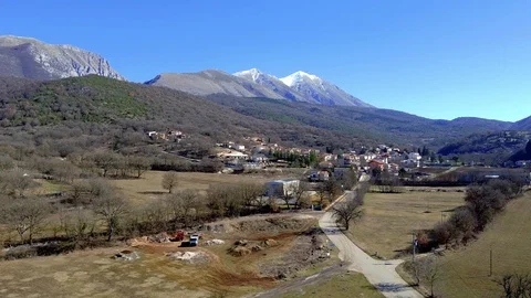 Aerial view of a small town in central Italy with a mountain Stock Footage 125100720