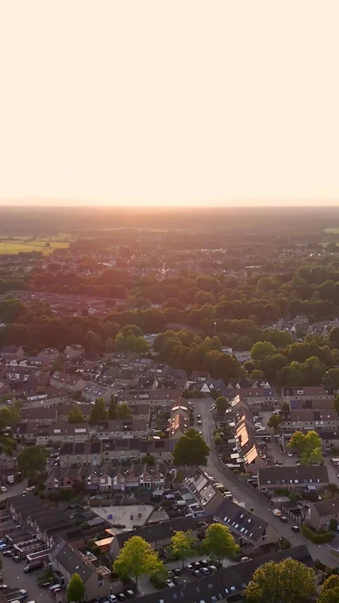 Aerial view of a small town during golden hour sunset Video stock 327109248