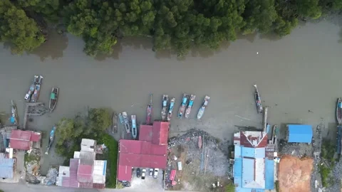 Aerial view of small town, jetty, mangrove and river in Kuala Sepetang Stock Footage 152566036