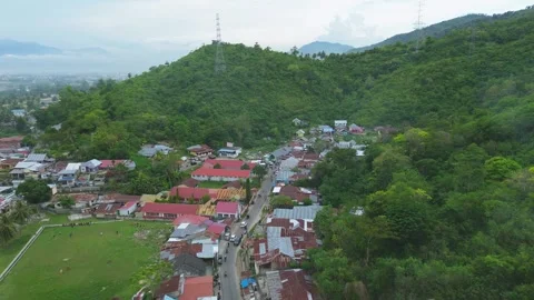Aerial view of a small town in the middle of the mountains Video stock 302781802