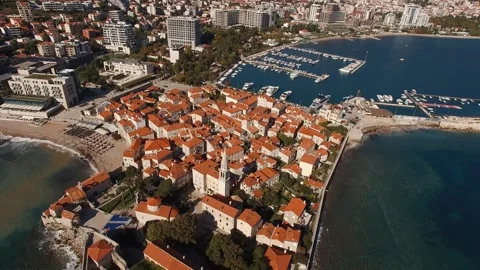 An aerial view of a small town next to a body of water Stock Footage 274929318