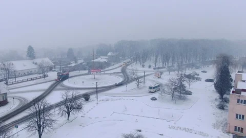 Aerial view of small town in snowfall. Blizzard. Snowstorm. Stock Footage 120784217