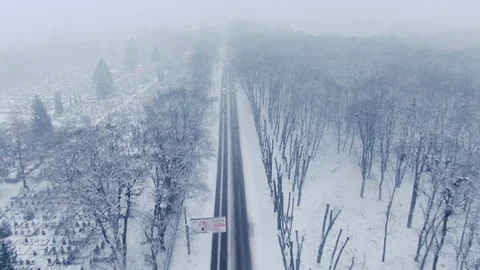 Aerial view of small town in snowfall. Blizzard. Snowstorm. Stock Footage 120786551