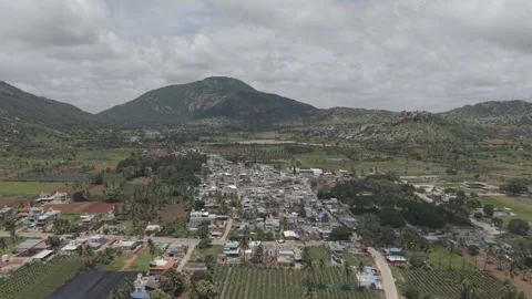 Aerial view of Small town sorrounded with mountains Stock Footage 320317173