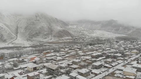 Aerial view of small town Stepantsminda, Kazbegi near mountain Kazbek, Georgia Видео 120141910