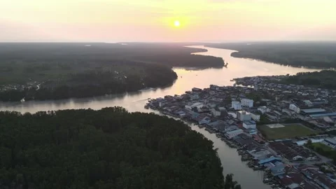 Aerial view of small town, sunset, mangrove and river in Kuala Sepetang Stock Footage 152565978
