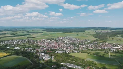 Aerial View of Small Town Surrounded by Farmland, Wide Drone Shot Vídeo Stock 342316280