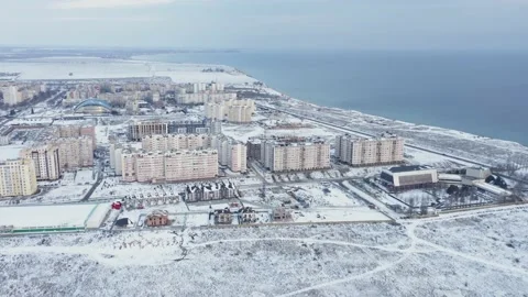 Aerial view of a small town under construction near the ocean. Stock Footage 236200394