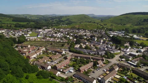 Aerial view of a small town in the Welsh countryside Stock Footage 336754883